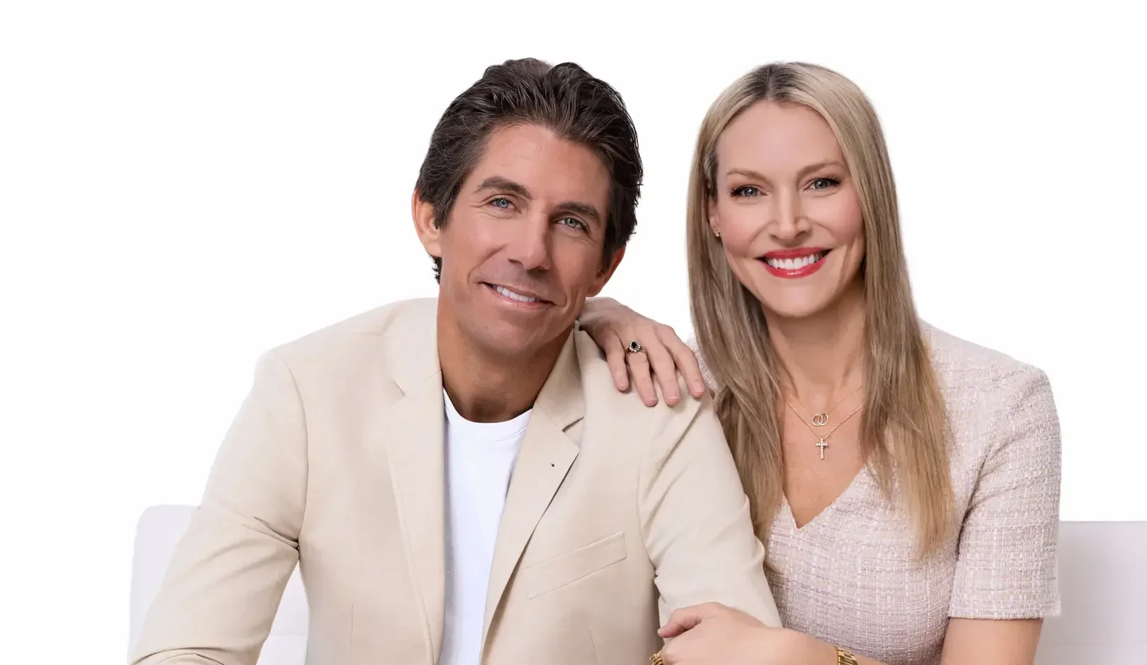 Potthast Dawson Design — professional studio portrait of the husband-and-wife interior design team seated together against a white background.